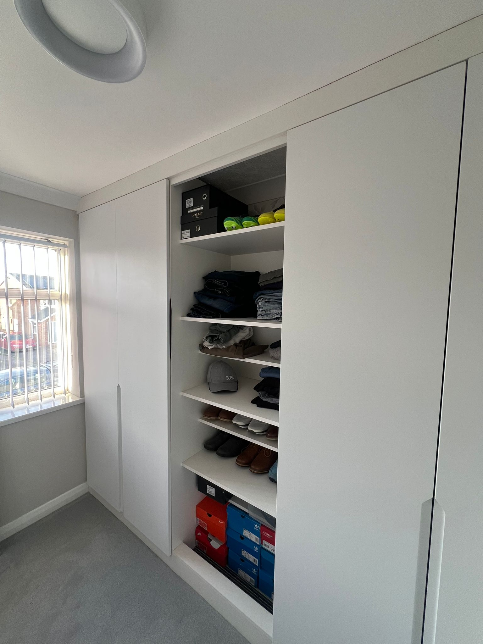 White Handleless Wardrobes with Open Shelving